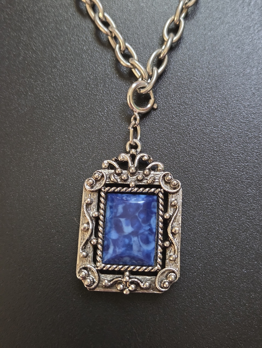 Elegant Silver and Blue Pendant Necklace With Detailed Backing